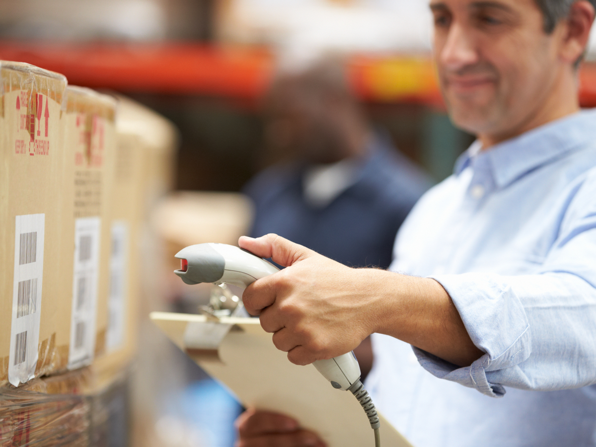 barcode-warehouse-worker-scanning-package