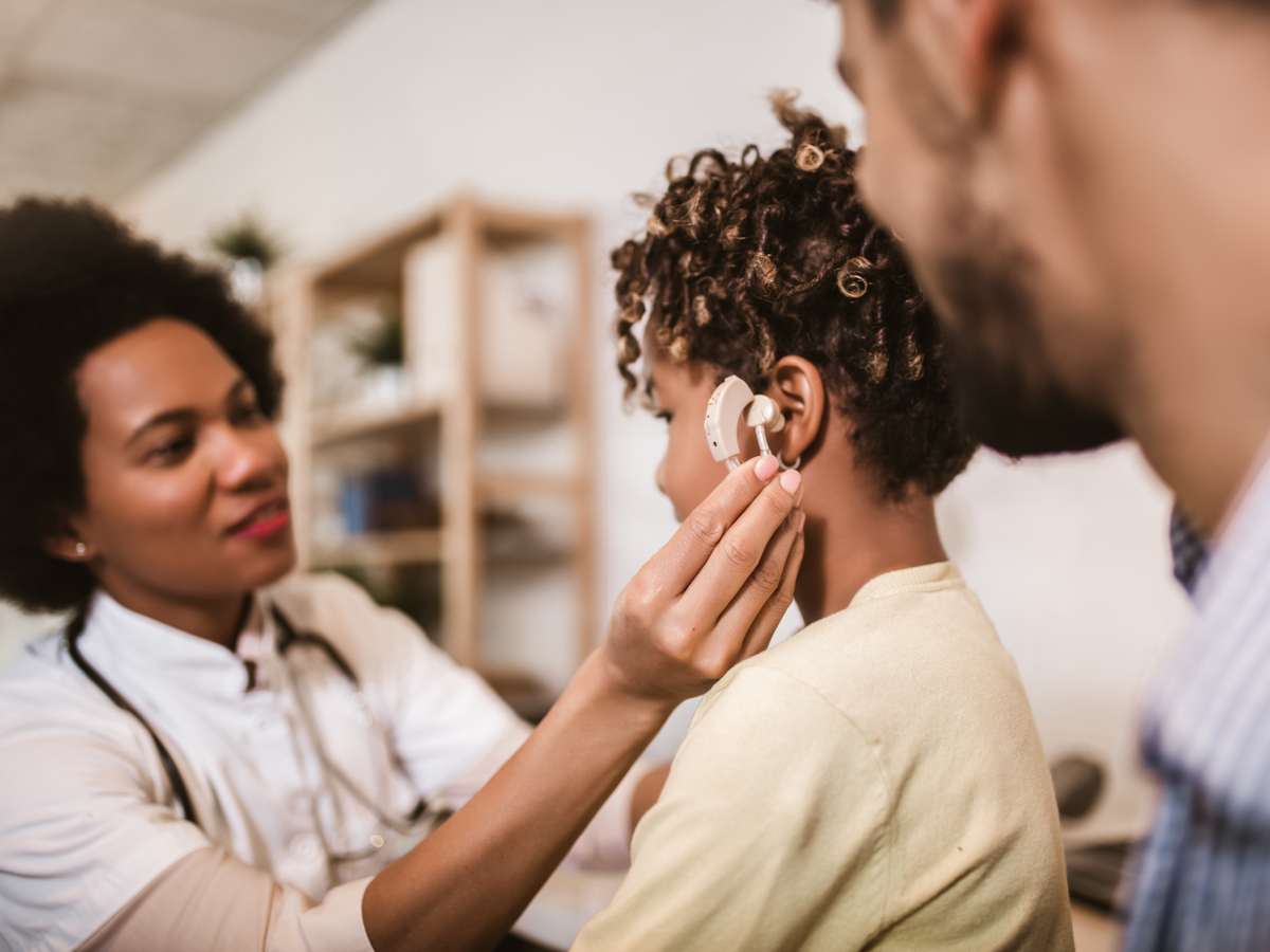 medical-device-smiling-girl-with-ear-implant