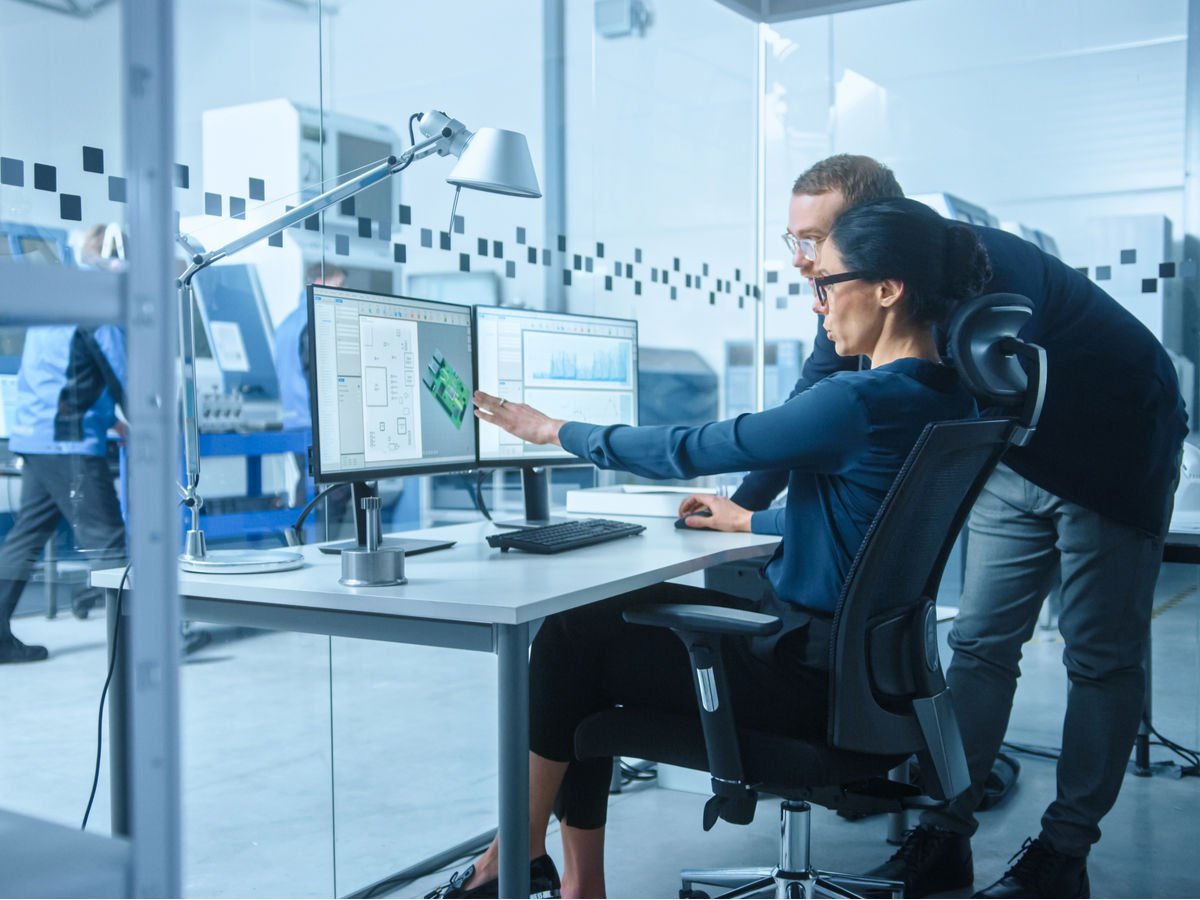 electronics-modern-factory-male-supervisor-talks.jpg