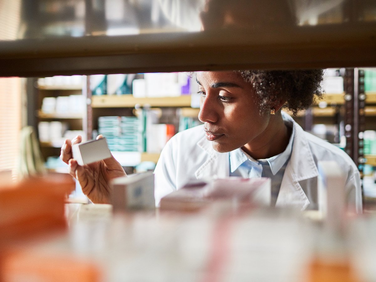 PHO-African-female-chemist-searching-the-medicines